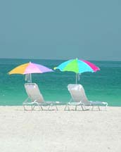 florida resort beach front picture of beach chair  on the beach near gulf Waters