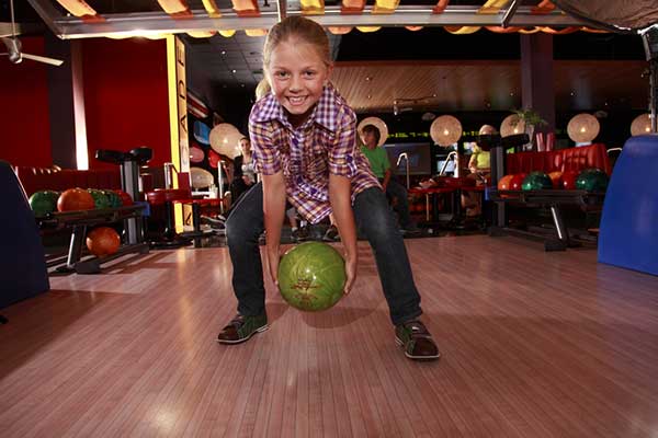 Child Bowling with two hands